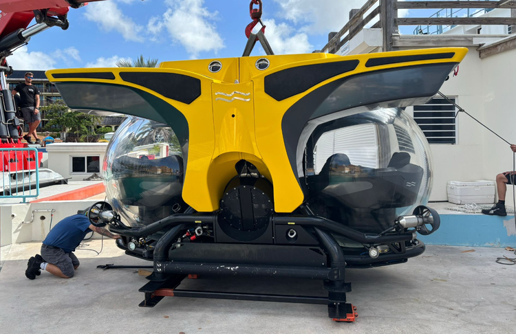 Front view of yellow dual-sphere Cruise Sub 7 during shoreside preparation